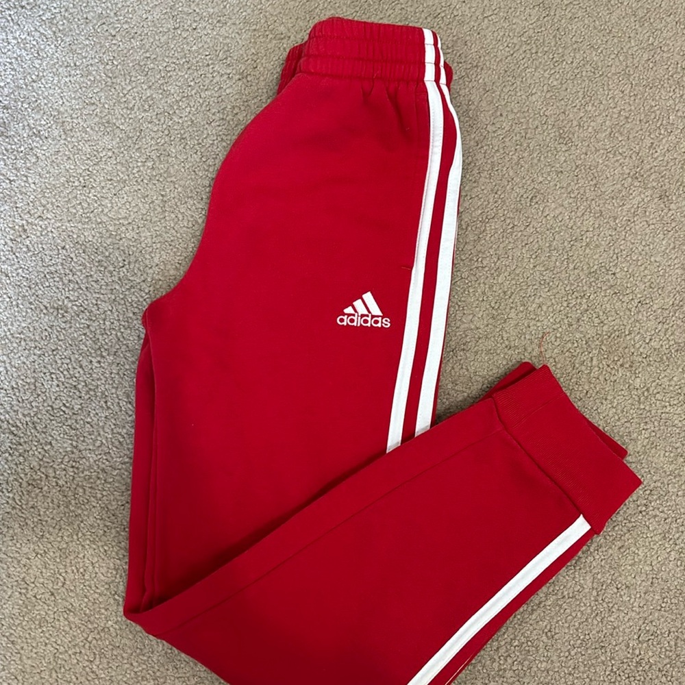 Kids adidas red joggers.
